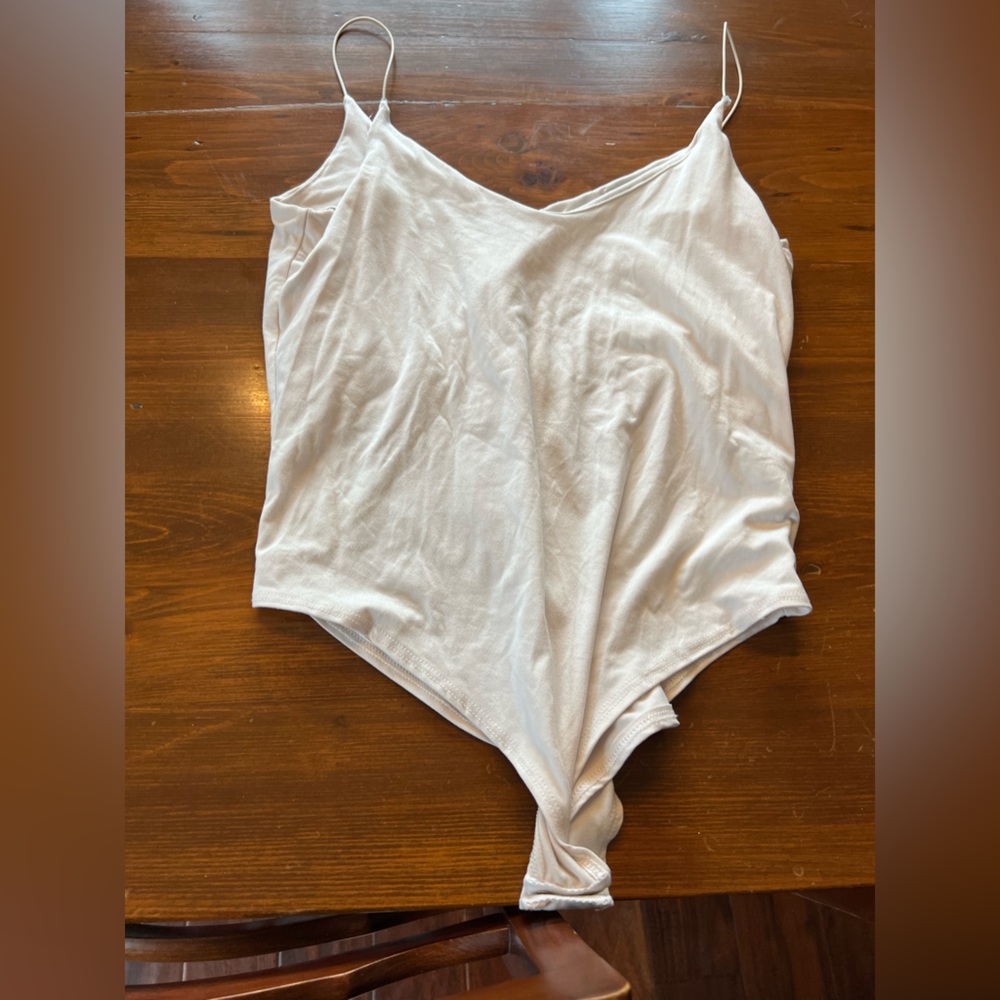 Thin strapped white bodysuit